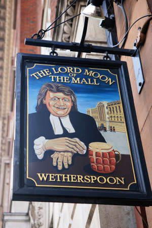 London, UK - November 04, 2010: English pub sign, Public house, known as pub, is focal point of community. Pub business, now about 53,500 pubs in UK, has been declining every year.のeditorial素材