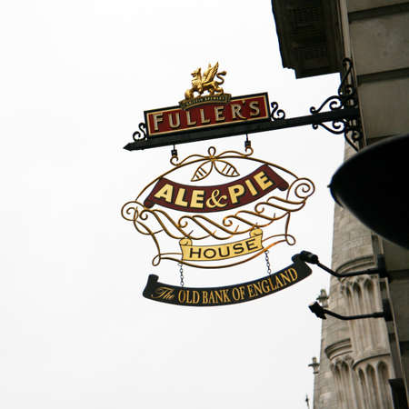 London, UK - May 08, 2010: English pub sign, Public house, known as pub, is focal point of community. Pub business, now about 53,500 pubs in UK, has been declining every year.のeditorial素材