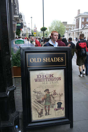 London, UK - May 7, 2006: English pub sign, Public house, known as pub, is focal point of community. Pub business, now about 53,500 pubs in UK, has been declining every year.のeditorial素材