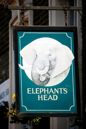 London, UK - April 20, 2013: English pub sign, Public house, known as pub, is focal point of community. Pub business, now about 53,500 pubs in UK, has been declining every year.のeditorial素材