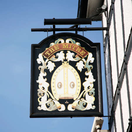 London, UK - March 29, 2012: English pub sign, Public house, known as pub, is focal point of community. Pub business, now about 53,500 pubs in UK, has been declining every year.のeditorial素材