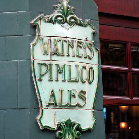 London, UK - August 16, 2010: English pub sign, Public house, known as pub, is focal point of community. Pub business, now about 53,500 pubs in UK, has been declining every year.のeditorial素材