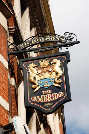 London, UK - April 15, 2012: English pub sign, Public house, known as pub, is focal point of community. Pub business, now about 53,500 pubs in UK, has been declining every year.のeditorial素材