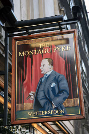 London, UK - November 04, 2010: English pub sign, Public house, known as pub, is focal point of community. Pub business, now about 53,500 pubs in UK, has been declining every year.のeditorial素材