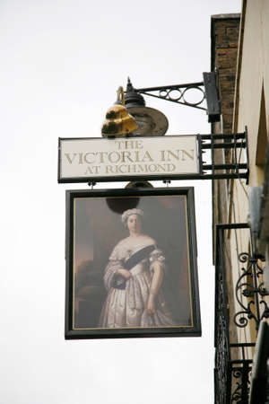 London, UK - September 16, 2012: English pub sign, Public house, known as pub, is focal point of community. Pub business, now about 53,500 pubs in UK, has been declining every year.のeditorial素材