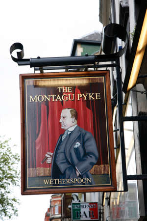 London, UK - May 06, 2012: English pub sign, Public house, known as pub, is focal point of community. Pub business, now about 53,500 pubs in UK, has been declining every year.のeditorial素材