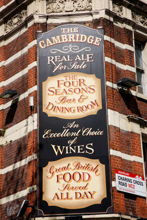 London, UK - April 15, 2012: English pub sign, Public house, known as pub, is focal point of community. Pub business, now about 53,500 pubs in UK, has been declining every year.のeditorial素材