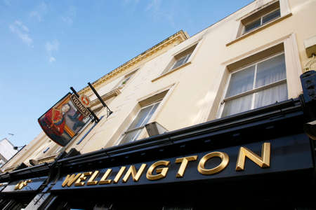 London, UK - April 15, 2012: English pub sign, Public house, known as pub, is focal point of...