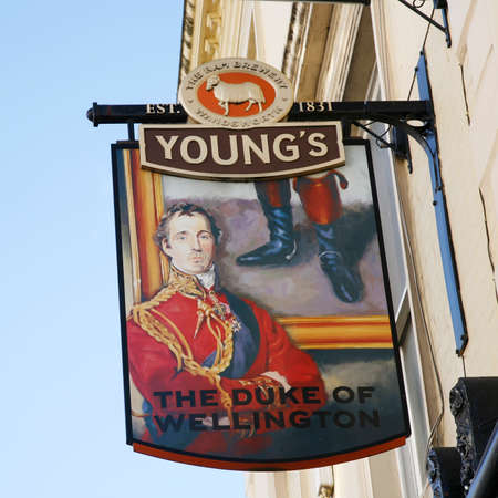 London, UK - April 15, 2012: English pub sign, Public house, known as pub, is focal point of community. Pub business, now about 53,500 pubs in UK, has been declining every year.のeditorial素材