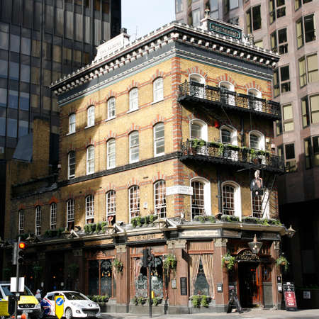 London, UK - March 25, 2012: Outside view of pub, for drinking and socializing, focal point of community. Pub business, now about 53,500 pubs in the UK, has been declining every year.のeditorial素材