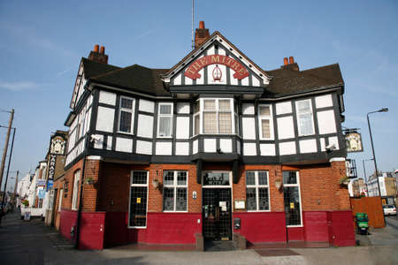 London, UK - March 29, 2012: Outside view of a public house, known as pub, for drinking and socializing, is the focal point of the community, Pub business, now about 53,500 pubs in the UK, has been declining every year.のeditorial素材