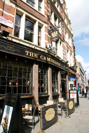 London, UK - April 15, 2012: Outside view of pub, for drinking and socializing, focal point of community. Pub business, now about 53,500 pubs in the UK, has been declining every year.のeditorial素材