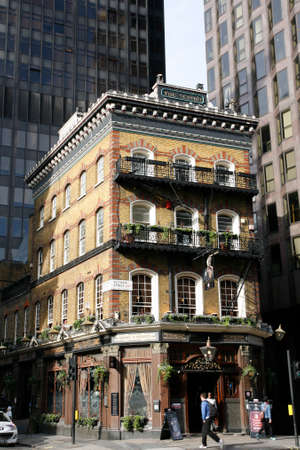 London, UK - March 25, 2012: Outside view of pub, for drinking and socializing, focal point of community. Pub business, now about 53,500 pubs in the UK, has been declining every year.のeditorial素材
