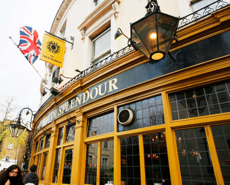 London, UK - Nov 25, 2012: Outside view of pub, for drinking and socializing, focal point of community. Pub business, now about 53,500 pubs in the UK, has been declining every year.のeditorial素材