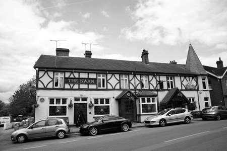 London, UK - May 16, 2012: Outside view of pub, for drinking and socializing, focal point of community. Pub business, now about 53,500 pubs in the UK, has been declining every year.のeditorial素材