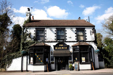 London, UK - April 01, 2012: Outside view of pub, for drinking and socializing, focal point of community. Pub business, now about 53,500 pubs in the UK, has been declining every year.のeditorial素材