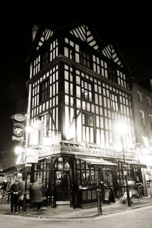 London, UK - Dec 11, 2012: Outside view of pub, for drinking and socializing, focal point of community. Pub business, now about 53,500 pubs in the UK, has been declining every year.のeditorial素材
