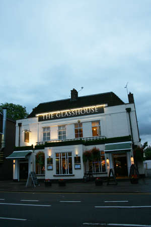 London, UK - July 26, 2010: Outside view of pub, for drinking and socializing, focal point of community. Pub business, now about 53,500 pubs in the UK, has been declining every year.のeditorial素材