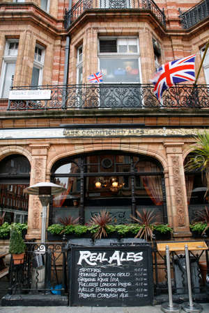 London, UK - May 05, 2012: Outside view of pub, for drinking and socializing, focal point of community. Pub business, now about 53,500 pubs in the UK, has been declining every year.のeditorial素材