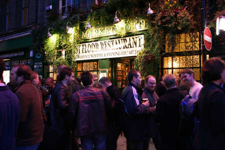 London, UK - April 13, 2006: Outside view of pub, for drinking and socializing, focal point of community. Pub business, now about 53,500 pubs in the UK, has been declining every year.のeditorial素材
