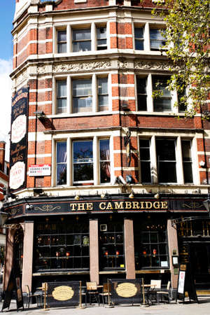 London, UK - April 15, 2012: Outside view of pub, for drinking and socializing, focal point of community. Pub business, now about 53,500 pubs in the UK, has been declining every year.のeditorial素材