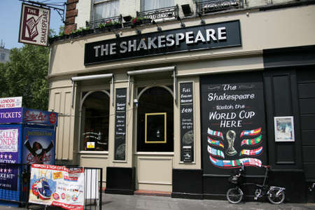 London, UK - May 25, 2010: Outside view of pub, for drinking and socializing, focal point of community. Pub business, now about 53,500 pubs in the UK, has been declining every year.のeditorial素材