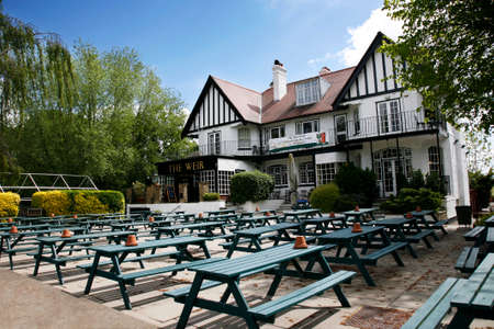 London, UK - May 16, 2012: Outside view of pub, for drinking and socializing, focal point of community. Pub business, now about 53,500 pubs in the UK, has been declining every year.のeditorial素材