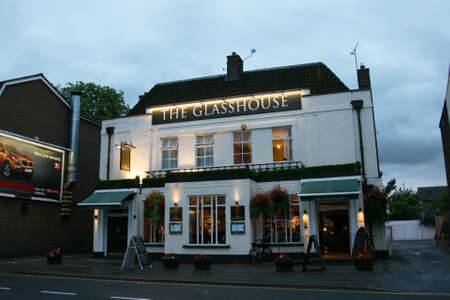 London, UK - July 26, 2010: Outside view of pub, for drinking and socializing, focal point of community. Pub business, now about 53,500 pubs in the UK, has been declining every year.のeditorial素材