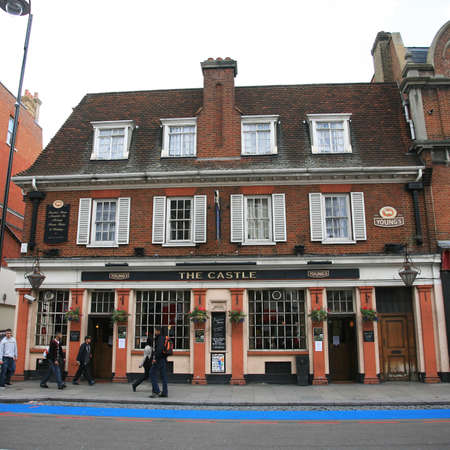 London, UK - May 27, 2010: Outside view of pub, for drinking and socializing, focal point of community. Pub business, now about 53,500 pubs in the UK, has been declining every year.のeditorial素材