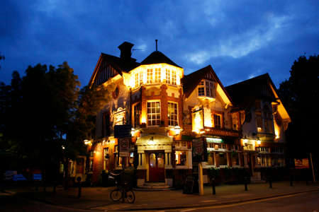 London, UK - May 16, 2012: Outside view of pub, for drinking and socializing, focal point of community. Pub business, now about 53,500 pubs in the UK, has been declining every year.のeditorial素材