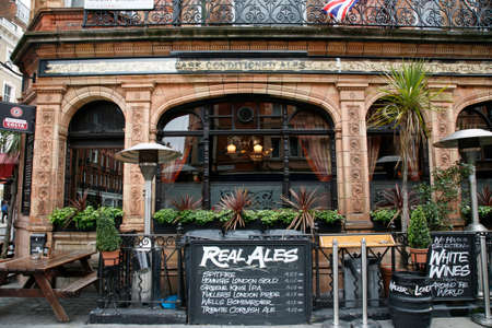 London, UK - May 05, 2012: Outside view of pub, for drinking and socializing, focal point of community. Pub business, now about 53,500 pubs in the UK, has been declining every year.のeditorial素材