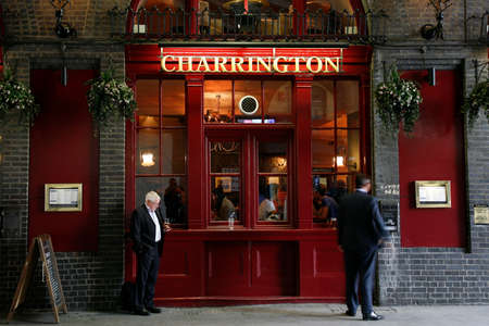 London, UK - April 30, 2012: Outside view of pub, for drinking and socializing, focal point of community. Pub business, now about 53,500 pubs in the UK, has been declining every year.のeditorial素材