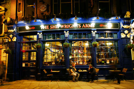 London, UK - Dec 17, 2012: Outside view of pub, for drinking and socializing, focal point of community. Pub business, now about 53,500 pubs in the UK, has been declining every year.のeditorial素材