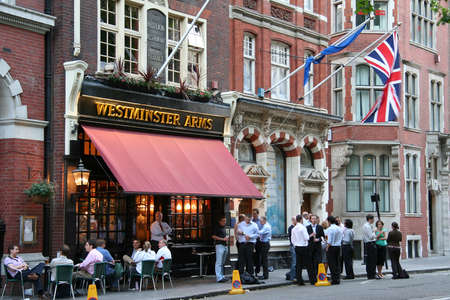 London, UK - June 7, 2006: Outside view of pub, for drinking and socializing, focal point of community. Pub business, now about 53,500 pubs in the UK, has been declining every year.のeditorial素材