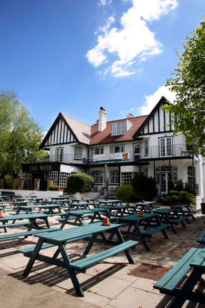London, UK - May 16, 2012: Outside view of pub, for drinking and socializing, focal point of community. Pub business, now about 53,500 pubs in the UK, has been declining every year.のeditorial素材