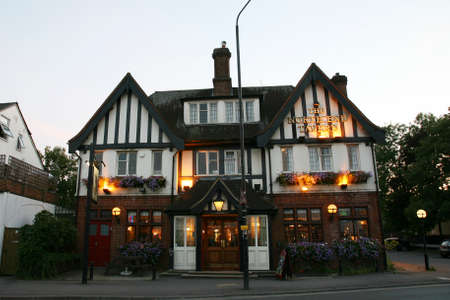London, UK - September 01, 2010: Outside view of pub, for drinking and socializing, focal point of community. Pub business, now about 53,500 pubs in the UK, has been declining every year.のeditorial素材