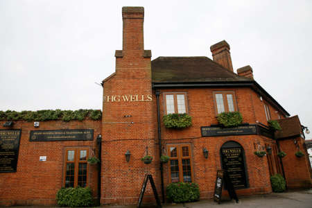 London, UK - May 19, 2012: Outside view of pub, for drinking and socializing, focal point of community. Pub business, now about 53,500 pubs in the UK, has been declining every year.のeditorial素材