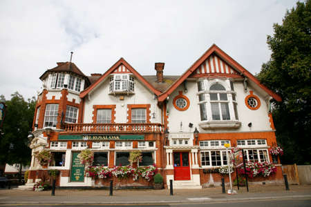 London, UK - August 14, 2011: Outside view of pub, for drinking and socializing, focal point of community. Pub business, now about 53,500 pubs in the UK, has been declining every year.のeditorial素材