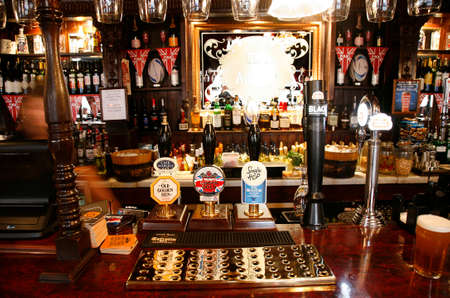 London, UK - May 5, 2012: Inside view of a public house, known as pub, for drinking and socializing, is the focal point of the community, Pub business has been declining every year.のeditorial素材