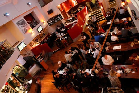 London, UK - May 6, 2012: Inside view of a public house, known as pub, for drinking and socializing, is the focal point of the community, Pub business has been declining every year.のeditorial素材