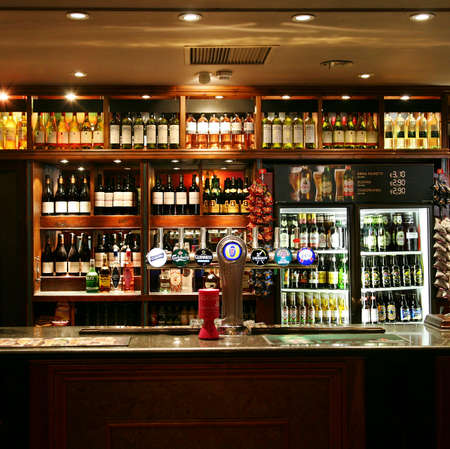 London, UK - June 03, 2011: Inside view of a public house, known as pub, for drinking and socializing, is the focal point of the community, Pub business has been declining every year.のeditorial素材