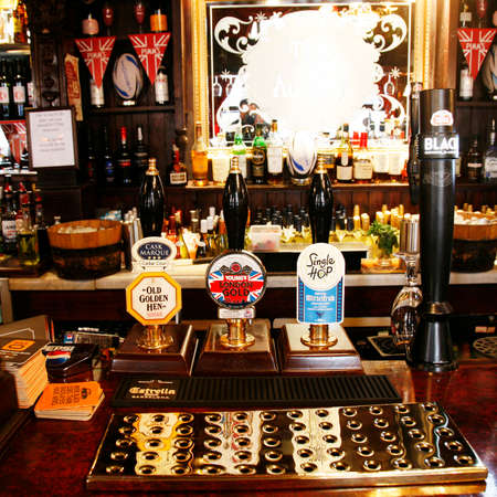 London, UK - May 5, 2012: Inside view of a public house, known as pub, for drinking and socializing, is the focal point of the community, Pub business has been declining every year.のeditorial素材