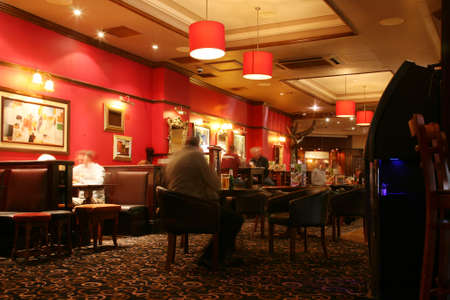 London, UK - September 06, 2010: Inside view of a public house, known as pub, for drinking and socializing, is the focal point of the community, Pub business has been declining every year.のeditorial素材