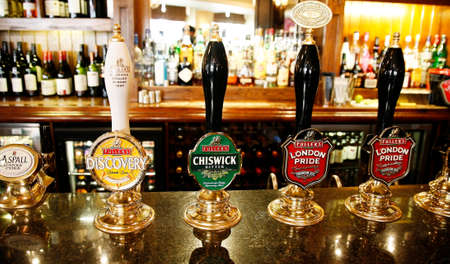 London, UK - May 12, 2012: Inside view of a public house, known as pub, for drinking and socializing, is the focal point of the community, Pub business has been declining every year.のeditorial素材