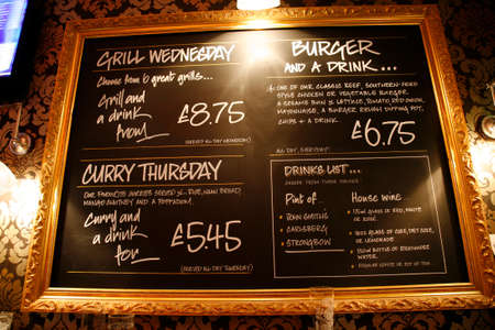 London, UK - April 30, 2012: Inside view of a public house, known as pub, for drinking and socializing, is the focal point of the community, Pub business has been declining every year.のeditorial素材
