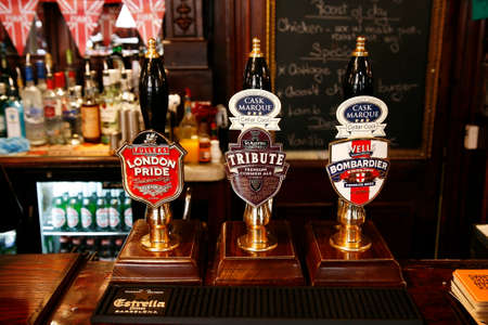 London, UK - May 5, 2012: Inside view of a public house, known as pub, for drinking and socializing, is the focal point of the community, Pub business has been declining every year.のeditorial素材