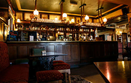 London, UK - May 16, 2012: Inside view of a public house, known as pub, for drinking and socializing, is the focal point of the community, Pub business has been declining every year.のeditorial素材
