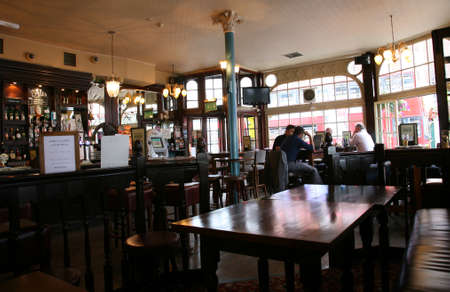London, UK - August 03, 2010: Inside view of a public house, known as pub, for drinking and socializing, is the focal point of the community, Pub business has been declining every year.のeditorial素材