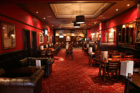 London, UK - June 03, 2011: Inside view of a public house, known as pub, for drinking and socializing, is the focal point of the community, Pub business has been declining every year.のeditorial素材
