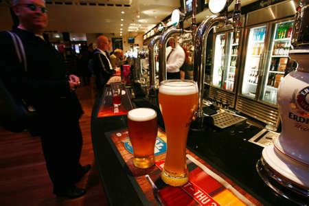 London, UK - October 5, 2013: Inside view of a public house, known as pub, for drinking and socializing, is the focal point of the community, Pub business has been declining every year.のeditorial素材